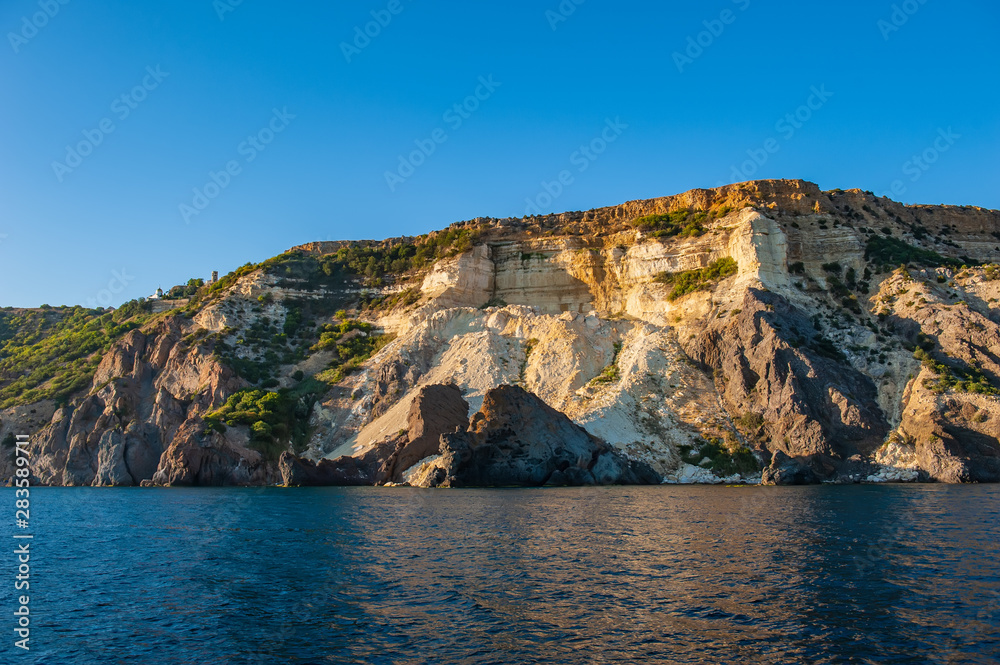 Landscape Sea Rocky Coast at Sunset. Sea and Rocks.