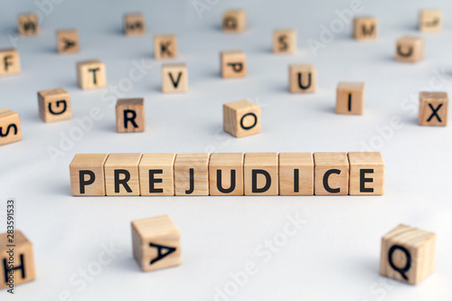 Foto prejudice - word from wooden blocks with letters,  personal opinions prejudice b