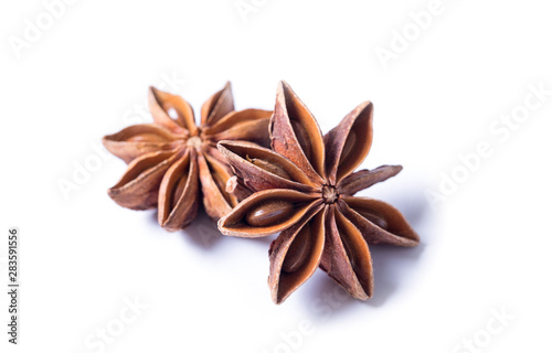 Star anise spice fruits and seeds isolated on white