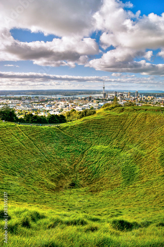 Mount Eden (Maungawhau) volcanic cone crater and summit above sweeping panorama of Auckland Cityand Waitemata Harbour. Mt Eden, Auckland City, New Zealand photo