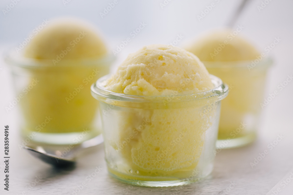 Yellow ice cream served in glass
