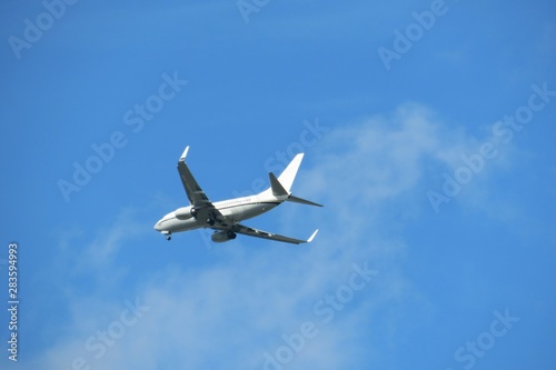 Airplane on blue sky background