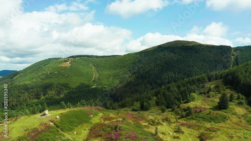 Aerial Flight Over Cloughmore Stone area, Kilbroney Park,countryside Northern Ireland. Hiking And Tourism Concept photo