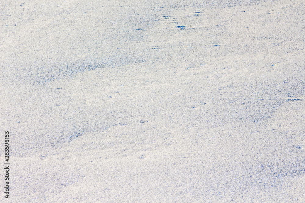 Snow texture. The surface of the earth is unevenly covered with snow_ Snow texture. The surface of the earth is unevenly covered with snow_