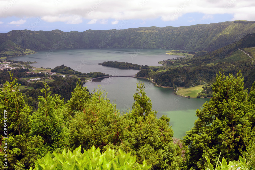 Beautiful views of the twin lake of Seti Sidadish, Lagoa das Sete Cidades in cloudy weather. Panorama. Attractions on the island of San Miguel, Portugal. Travel to the Azores.