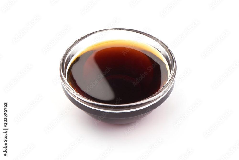 Dark caramel syrup, isolated on white background Dark caramel syrup, isolated on white background