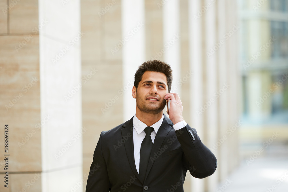 Businessman talking on mobile phone Businessman talking on mobile phone