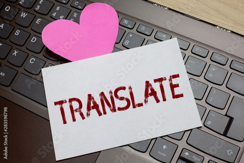 Word writing text Translate. Business concept for Another word with same equivalent meaning of a target language Paper Romantic lovely message Heart Keyboard Type computer Good feelings photo