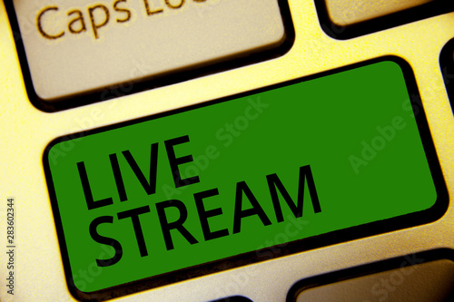 Handwriting text writing Live Stream. Concept meaning transmit or receive video and audio coverage over Internet Keyboard green key Intention create computer computing reflection document