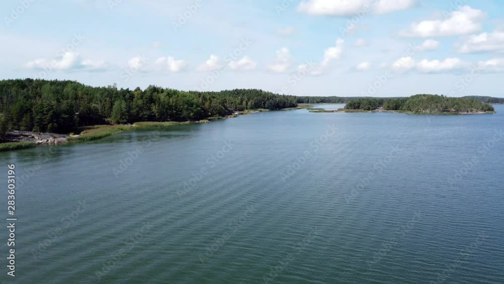 Tranquil windless summer day. Almost calm sea. View from Kaitainen bridge, Taivassalo, Finland. Tranquil windless summer day. Almost calm sea. View from Kaitainen bridge, Taivassalo, Finland.