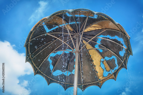 Moscow \ Russia 06 10 2019: Umbrella on the fountain near Yuri Nikulin circus on Tsvetnoy Boulevard photo