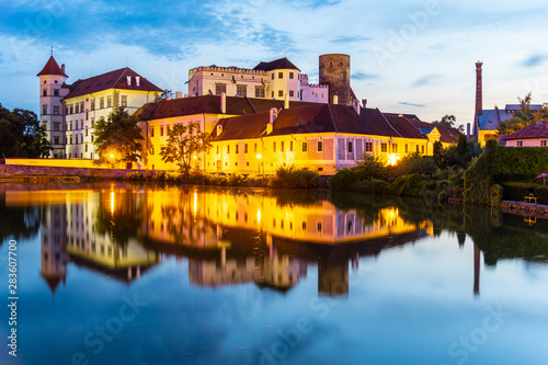 Jindrichuv Hradec Castle by night. Reflection in the water. Czech Republic