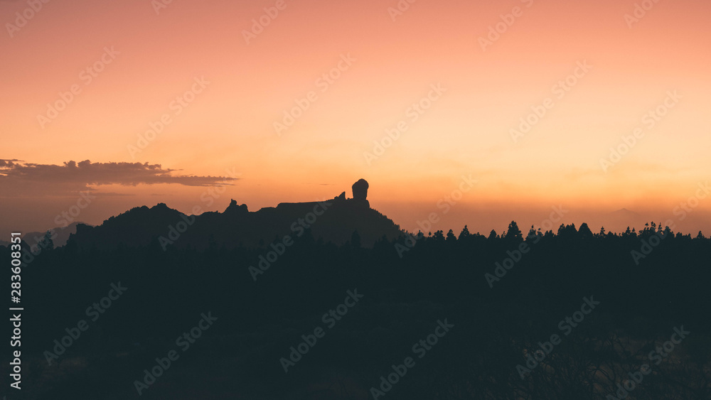 Sunset in Gran canaria. Roque nublo and Teide together.