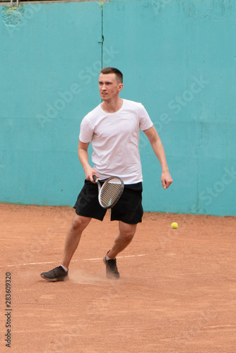 Beginner tennis player on the court. © Roman Penderev