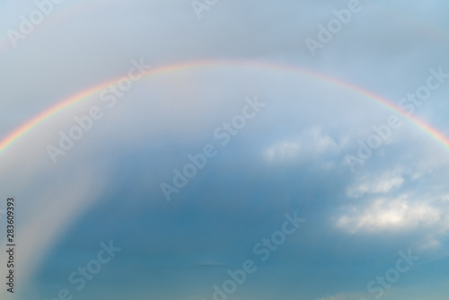Rainbow in the blue sky © Roman Penderev
