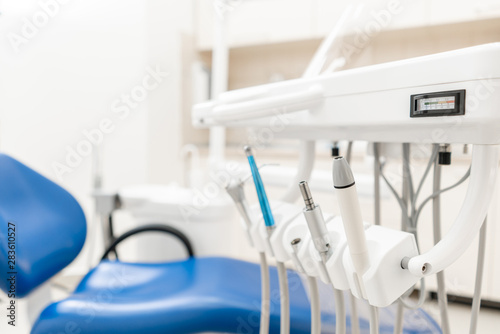 Stomatological instrument in the dentist clinic. Dental work in clinic. Operation  tooth replacement. Medicine  health  stomatology concept. Office where dentist conducts inspection and concludes.