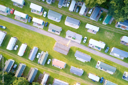Caravan site park aerial view illuminated by summer sun photo