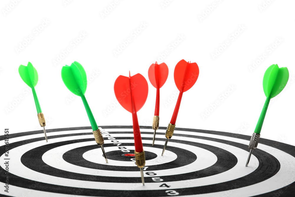 Arrows hitting target on dart board against white background Arrows hitting target on dart board against white background