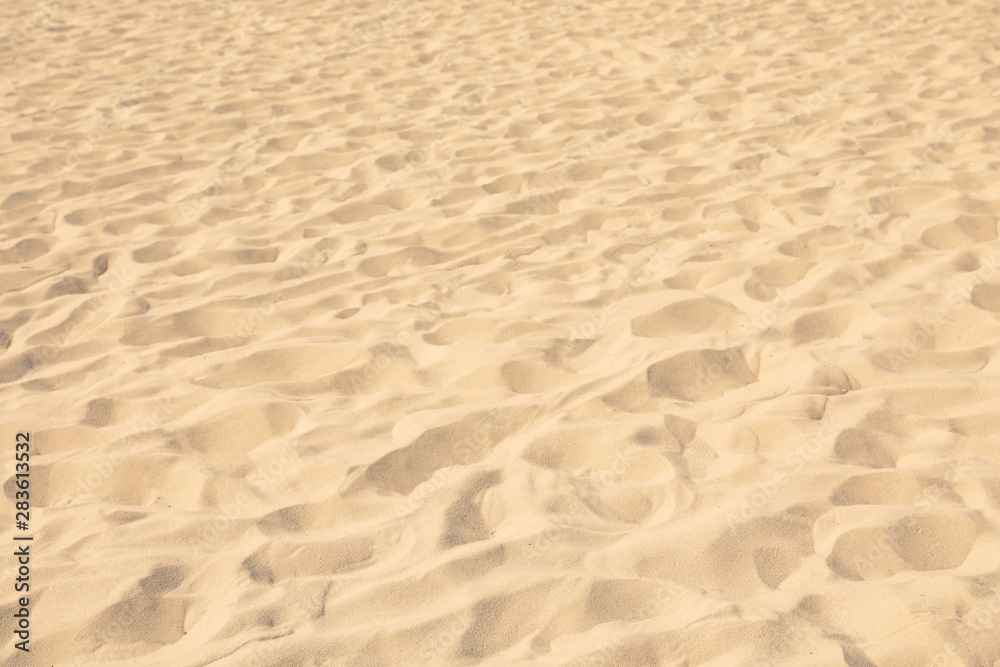 Golden beach sand on sunny day as background Golden beach sand on sunny day as background