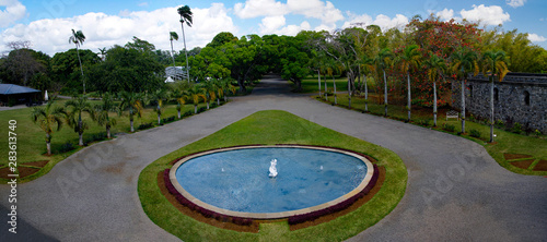 A beautiful garden with alley covered with old platanes trees in Chateau de Labourdonnais, a colonial palace, Riviere Du Rempart, Mauritius photo