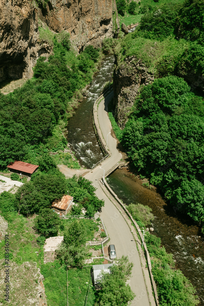 The road is located in the mountains The road is located in the mountains