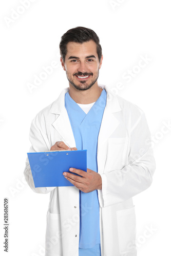 Young male doctor in uniform with clipboard on white background. Medical service