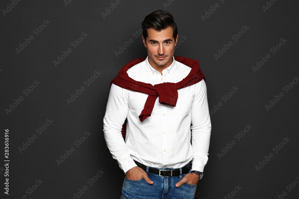 Portrait of handsome young man on dark background Portrait of handsome young man on dark background