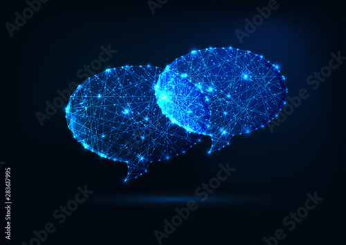 Two futuristic glowing low polygonal speech bubbles isolated on dark blue background.