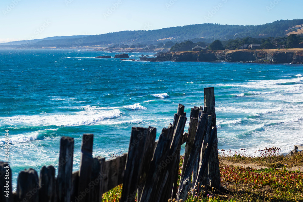 an old fence blocks a cliff edge along the northern california coast an old fence blocks a cliff edge along the northern california coast