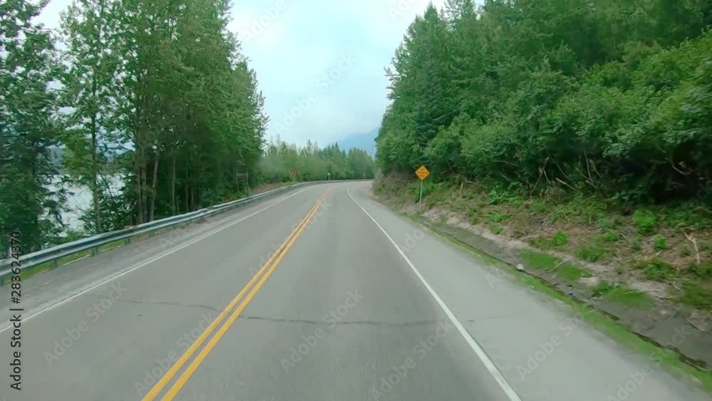 POV through front windshield while driving on the Sterling Highway in Alaska; visible are smoke from local wildfire, Kenai River, Chugach National Forest and Kenai Mountains POV through front windshield while driving on the Sterling Highway in Alaska; visible are smoke from local wildfire, Kenai River, Chugach National Forest and Kenai Mountains