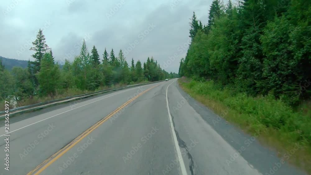 POV through front windshield while driving on the Seward Highway in Alaska; visible are smoke from local wildfire,Trail Lake, Chugach National Forest and Kenai Mountains POV through front windshield while driving on the Seward Highway in Alaska; visible are smoke from local wildfire,Trail Lake, Chugach National Forest and Kenai Mountains