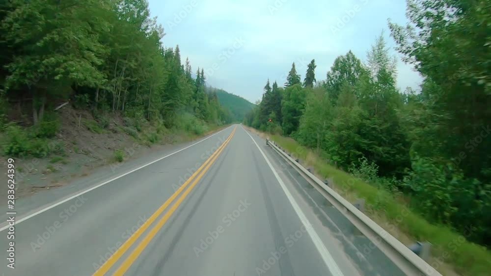 POV through front windshield while driving on the Seward Highway in Alaska; visible are smoke from local wildfire, Kenai Lake, Chugach National Forest and Kenai Mountains POV through front windshield while driving on the Seward Highway in Alaska; visible are smoke from local wildfire, Kenai Lake, Chugach National Forest and Kenai Mountains