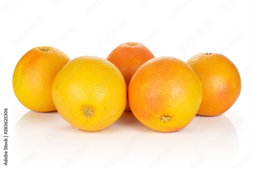 Group of five whole fresh pink grapefruit arranged symmetrically isolated on white background Group of five whole fresh pink grapefruit arranged symmetrically isolated on white background
