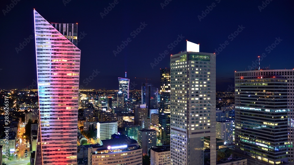 Obraz premium Modern office building at night. Night lights, city office building downtown, cityscape view 