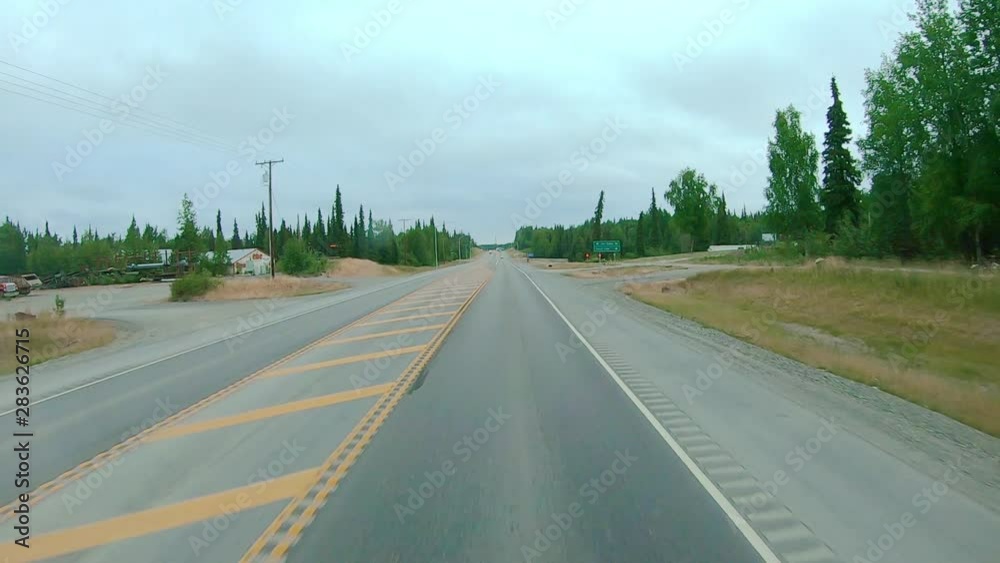 POV through front windshield while driving on the Sterling Highway in Alaska; visible are smoke from local wildfire, Kenai River, Chugach National Forest and Kenai Mountains POV through front windshield while driving on the Sterling Highway in Alaska; visible are smoke from local wildfire, Kenai River, Chugach National Forest and Kenai Mountains