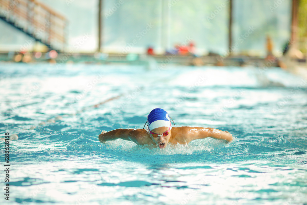 Young male swimmer swimming
