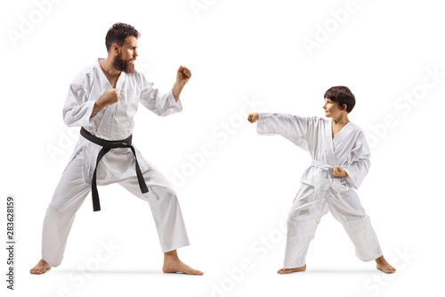 Karate instructor exercising with a boy