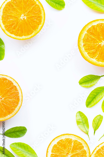 Orange with green leaves isolated on white background.
