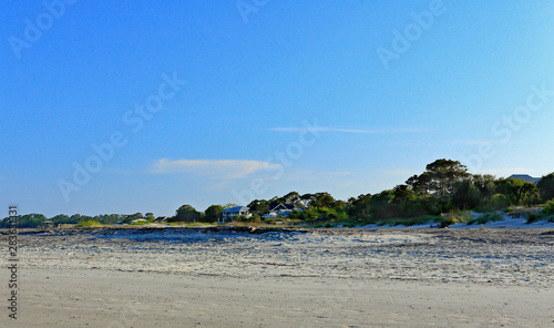 Dunes, trees and houses in the early morning