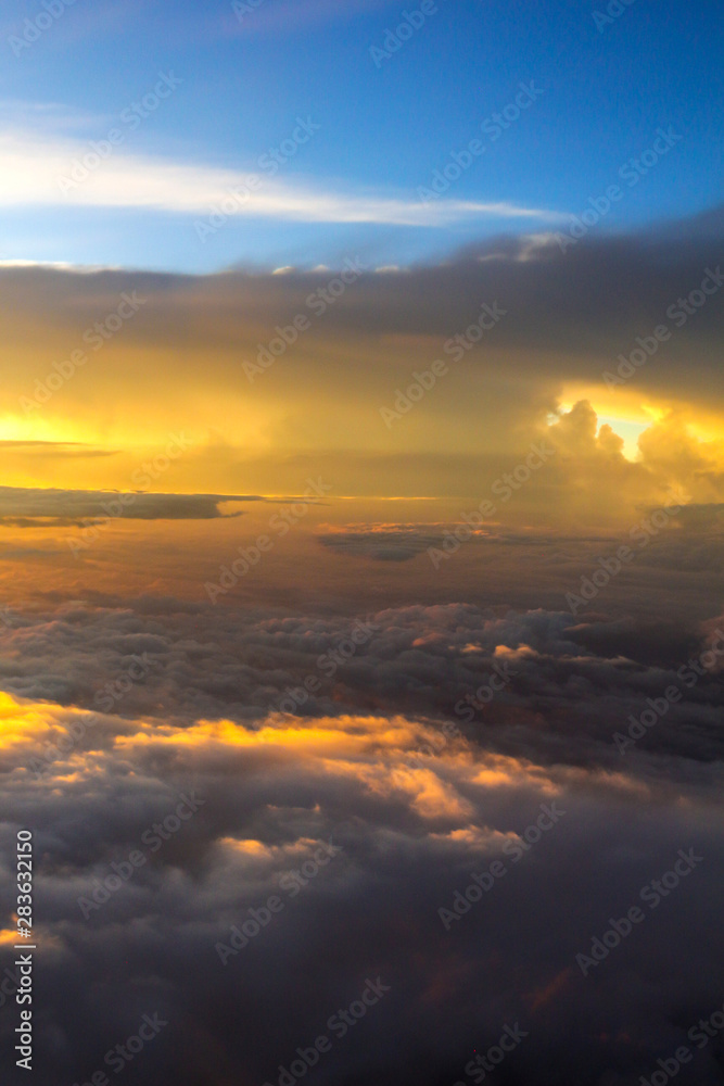 Spectacular sky with golden clouds and bright sunlight