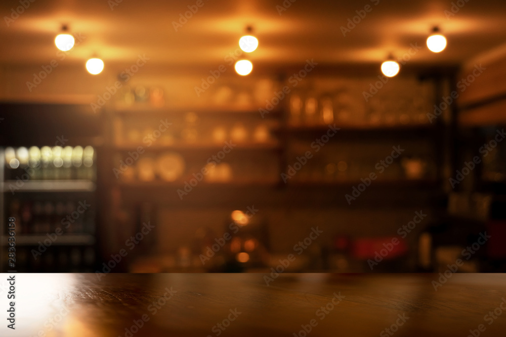 top of wood table with blur light form the dark night bar party interior background