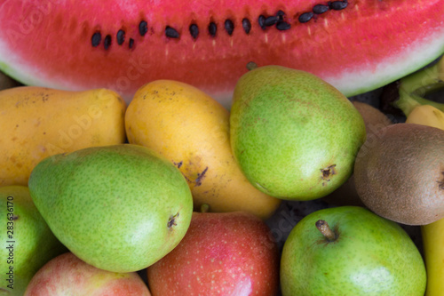 Lots of watermelon, apple, bananas and pears