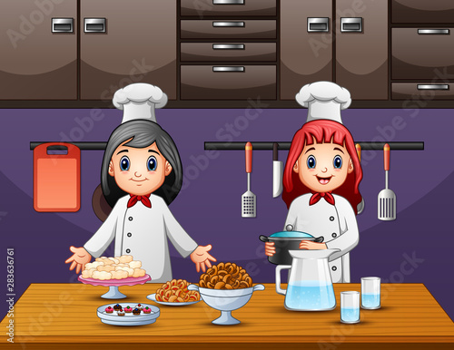 Two women chef preparing food in the kitchen
