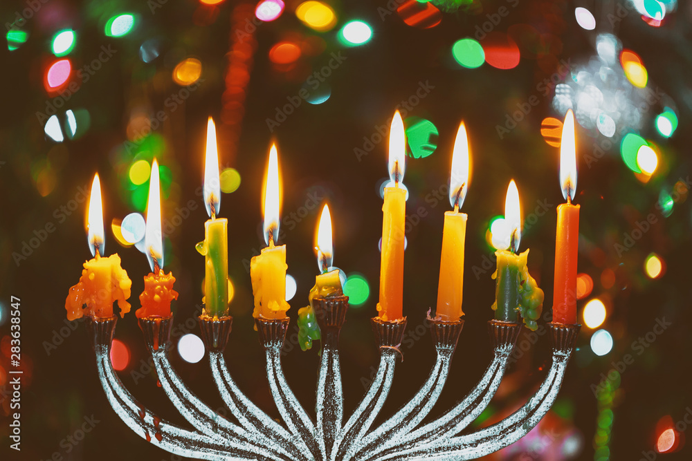 Brightly Glowing Hanukkah Menorah soft focus Brightly Glowing Hanukkah Menorah soft focus
