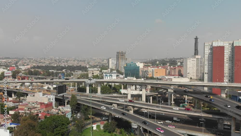 Aerial panoramic view of a traffic jam on a city highway during rush hour. Drone hovering in front of the cars. Aerial panoramic view of a traffic jam on a city highway during rush hour. Drone hovering in front of the cars.