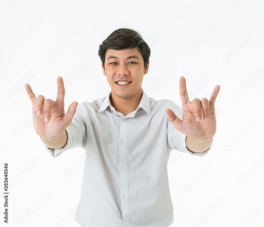 Smiling asian man showing fingers love sign isolated on white background Smiling asian man showing fingers love sign isolated on white background