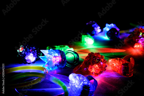 Multi-colored red, green, and blue glowing party rings, lights, and bracelets
