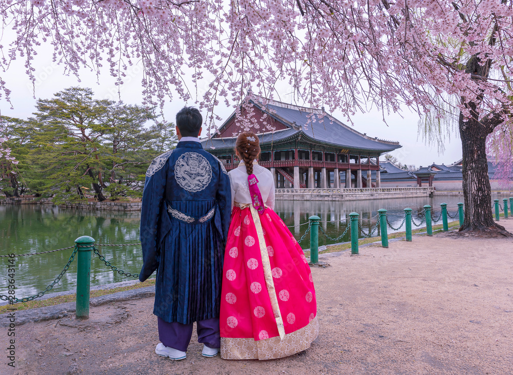 Gyeongbokgung Palace with Korean national dress and cherry blossom in spring,Seoul,South Korea. Gyeongbokgung Palace with Korean national dress and cherry blossom in spring,Seoul,South Korea.