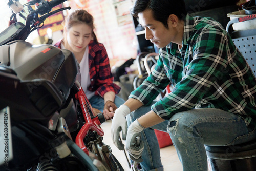 Couple of biker with repair.