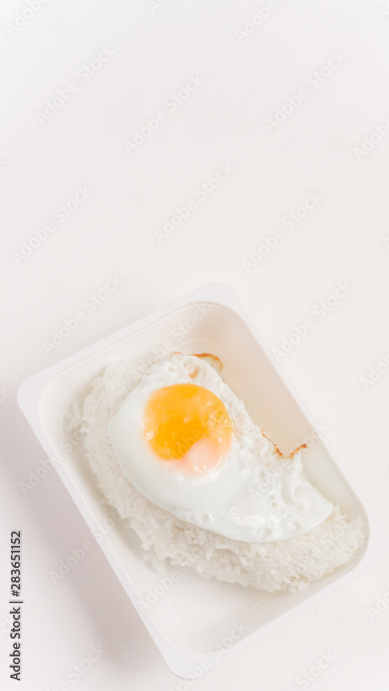 The inner box of rice is fried egg with white rice. The inner box of rice is fried egg with white rice.